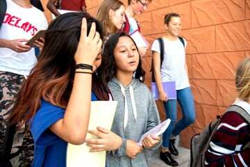 Fototapeta premium Students walking together outside school