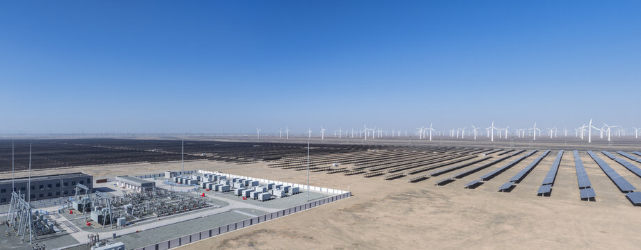 Vast Solar And Wind Power Plant With Substation In Desert