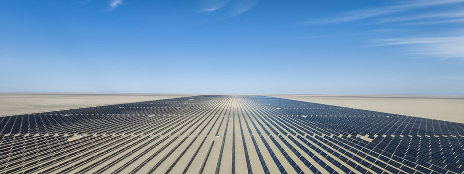 Aerial Panoramic View of Vast Solar Panel Farm in Gobi Desert﻿