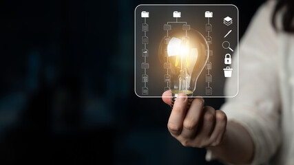Creative Concept of Innovation and Technology with Light Bulb and Digital Icons Representing Ideas and Data Management for Modern Business Solutions. Sentient. © InfiniteFlow