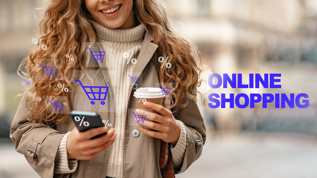 Woman smiles while shopping online on her phone in a city with a coffee cup in her hand