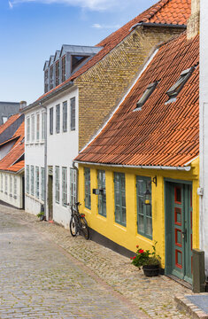 Colorful yellow house in the historic streets of Haderslev, Denmark
