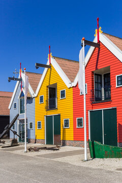 Colorful wooden buildings in the harbor of Zoutkamp, Netherlands