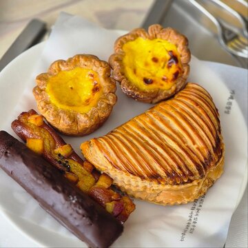 Freshly Baked Pastries, Egg Tart and Apple Turnover on Plate