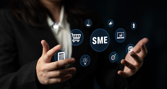 Businesswoman with futuristic icons representing small and medium enterprises, showcasing technology, innovation, and growth in a professional setting. Glyphic.