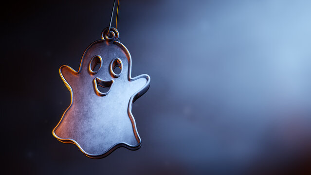 Playful metallic Halloween ghost ornament in a dark misty scene.