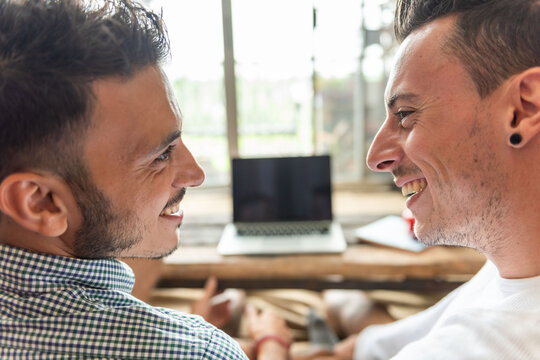 Smiling friends enjoying conversation together