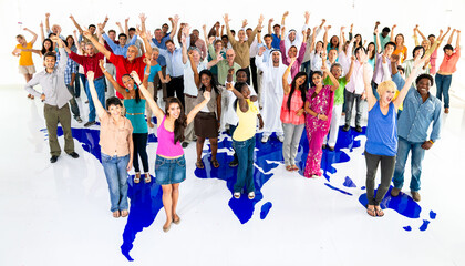 Fototapeta premium Diverse men and women standing over a world map, cheering together