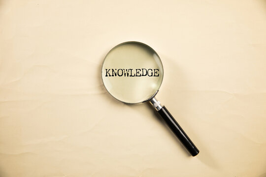 KNOWLEDGE word on white paper
