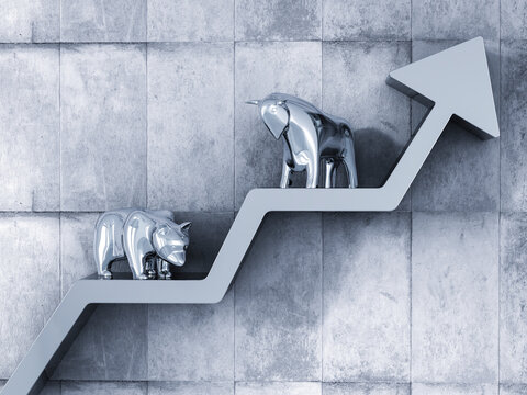 Bull and bear standing on upward pointing stock chart