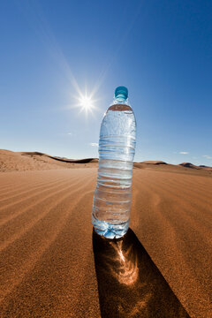 Africa, Namibia, Namib Desert, Water bottle on sand in namib-naukluft national park