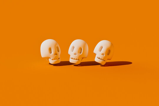 Three 3D Halloween skulls float on an orange background