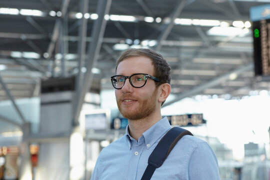 Germany, Cologne, Mid adult man with bag strap