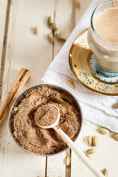 Indian Chai with spices and homemade chai masala powder, black pepper, cardamom, cinnamon, ginger, cloves, nutmeg