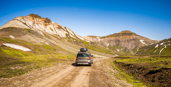 SUV driving on F946 gravel road in remote Mj�ifj�r�ur Eastfjords Iceland