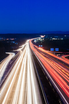 Germany, Baden-Wuerttemberg, Autobahn A8 near Wendlingen in the evening, light trails