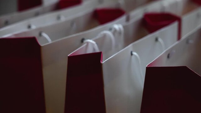 New Year corporate gifts souvenirs presentation for company employees, Christmas party presents exchange, gift bag package for conference participants, gift giving at office work, red white paper bags
