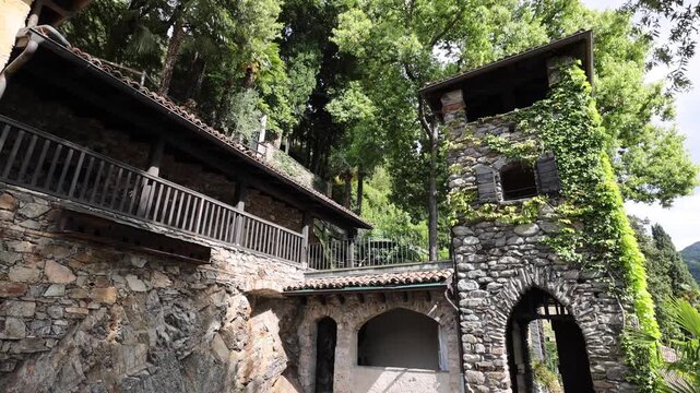 View of the historic stone architecture and arched entrance in Morcote, Ticino, Switzerland.