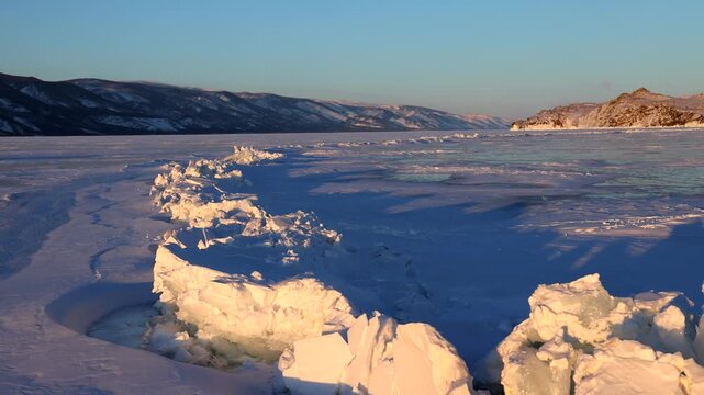 View of frozen Lake Baikal with jagged ice ridges in Khuzhir, Irkutsk Oblast, Russia.