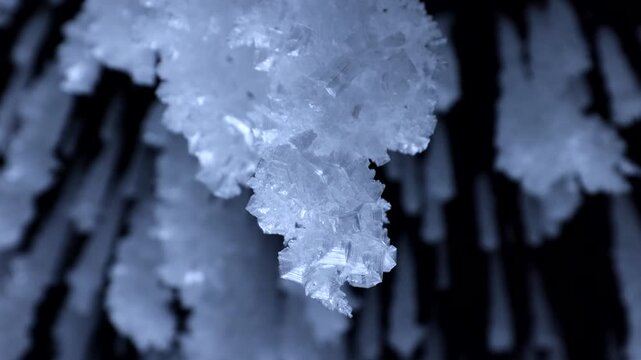 View of intricate ice crystals and icicles hanging from a rock formation at Lake Baikal in Khuzhir, Irkutsk Oblast, Russia.