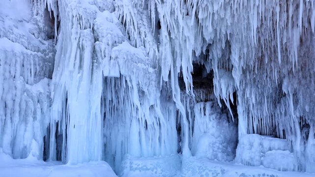 View of massive ice formations and icicles covering the rocky cliffs of Lake Baikal in Khuzhir, Irkutsk Oblast, Russia.