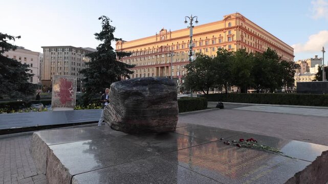 View of the Solovetsky Stone monument in Lubyanka Square with the historic FSB building in the background in Moskva, Moskva, Russia.