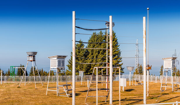 Weather station with rain gauge monitoring atmospheric data for meteorology and climate studies