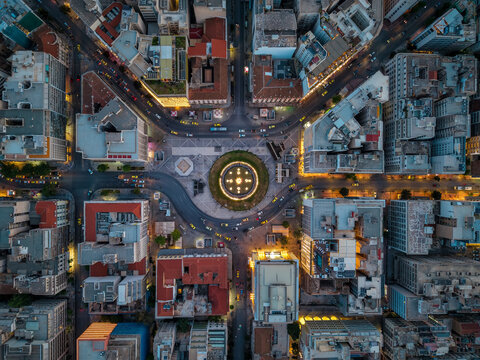 Aerial overhead view of the Omonia square and streets of central Athens, Greece, during dusk