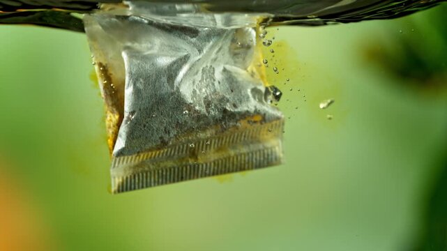 Super Slow Motion of Falling and Extracting Tea Bag in Hot Water at 1000fps.