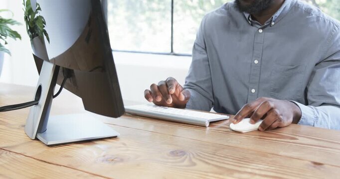 Lifestyle videos indoor of people doing activities at office, typing on keyboard, man working on com