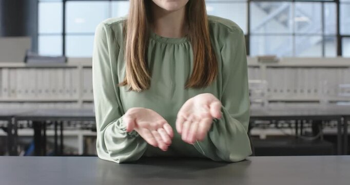 Close up of people talking to the camera, explaining business concept, woman gesturing with hands in