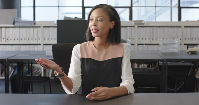 Close up of people talking to the camera, businesswoman sitting at desk, talking during meeting in m