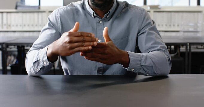 Close up of people talking to the camera, explaining strategy, man gesturing with hands in office