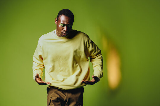 Urban street dancer expressing movement in a studio setting