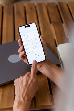 Smartphone displaying digital calendar app with scheduled events