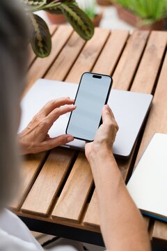 White Person holding smartphone