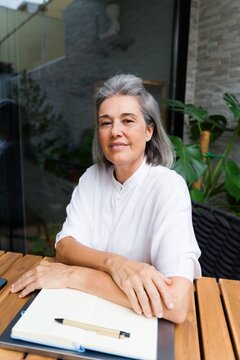 Middle-aged white woman sitting