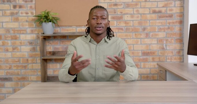 Close up of people talking to the camera, businessman sitting at desk, explaining ideas