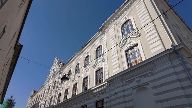 Ornate historic facade of Sibiu City Hall under clear blue sky in Piata Mare Sibiu Romania
