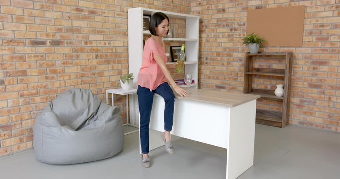 Lifestyle videos indoor of people doing activities at office, drinking water, woman taking break whi