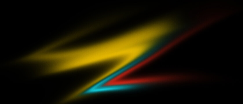 Abstract yellow blue red streaks against black background with soft focus