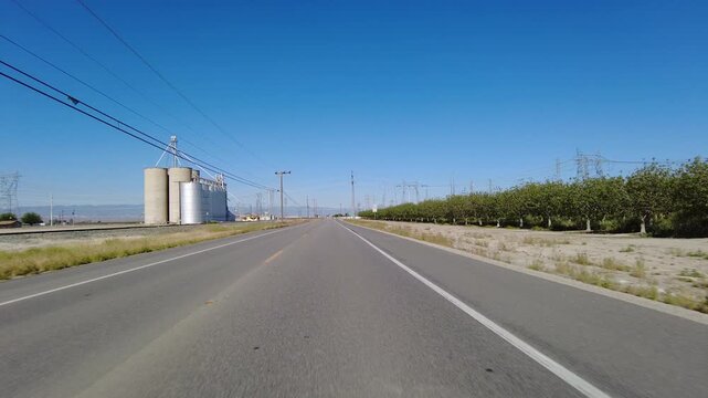 San Joaquin Valley Farmland Buttonwillow 05 Front View Driving Plates of Highway 58 West California USA