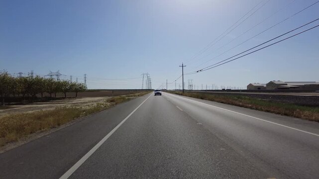 San Joaquin Valley Farmland Buttonwillow 05 Rear View Driving Plates of Highway 58 West California USA