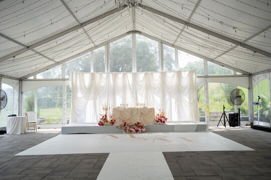 View of elegant wedding sweetheart table with floral decorations.