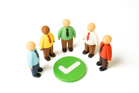 Group of business people standing around a check mark. Agreement and consensus concept. Contract signing, decision making and reaching consensus. Cooperation builds trust, partnership