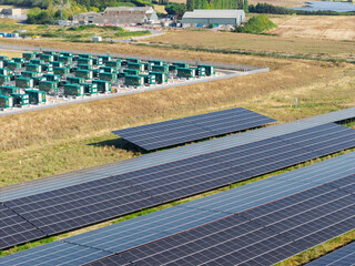 Large Battery Energy Storage Facility and Solar Panel Farm Located in the Countryside During Daytime © Tom