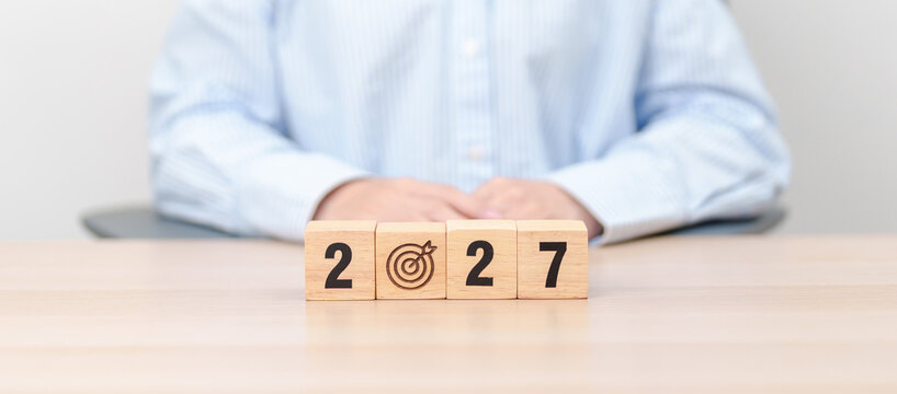  2027 year block with dartboard icon. Goal, Target, Resolution, strategy, plan, Action, mission, motivation, and New Year start concepts