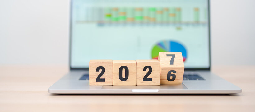 2026 end year to Happy New Year 2027 block with computer laptop background. Goal, Target, Resolution, strategy, plan, Action, mission, motivation, and New Year start concepts