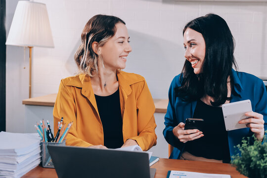 Portrait of military mother helping teen daughter with homework and eating lunch