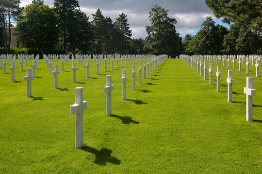 Rows of white cross headstones at the Normandy American Cemetery in Colleville-sur-Mer, France